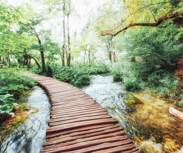 Plitvice Lakes National Park, tourist route on the wooden flooring along the waterfall, Croatia